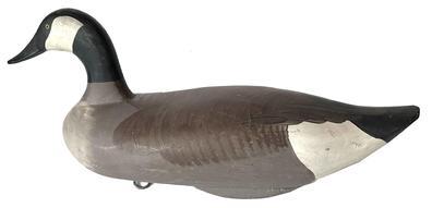 J340 Canadian Goose decoy carved by Madison Mitchell, Havre de Grace, MD (1901-1993) retaining its original painted surface. This is a weighted, full body sized goose decoy measuring approximately 24" long x 11 tall x 10 wide.