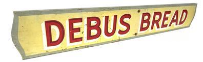 J401 Wood Advertising Sign for Debus Bread. Single sided with the lettering being hand painted in red with white and dark red shadowing on a yellow background. A sage green painted border surrounds the edges of the sign.  Measurements: 36 wide x ¾ thick x 5 5/8 tall (NOTE: Debus was founded in 1923 in Exeter Nebraska and was sold out to Metz Baking Co. of Sioux City, Iowa in February 1964.)