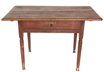 Exceptional 18th century New England work table in beautiful original dry red paint. The one board top has breadboard ends that are pegged on and battens below to keep it from warping/twisting that are secured with large square head nails. The top is secured to the base with large wooden pegs. One dovetailed drawer with original wooden knob. Base is mortised and pegged. Nicely turned legs and pad feet. The wood is pine. Measurements: 41 3/4� wide x 25� deep x 26 1/2� tall  