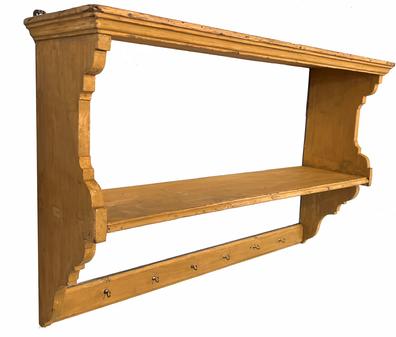 G97 19th century painted pine hanging Wall shelf, retaining beautiful mustard painted surface.  Wall shelf is dovetailed and features a nice, molded edge around the top, shaped ends with a single shelf that is mortised through the sides, and a board with hooks across the bottom.   Measurements: 41 ¼� wide x 25 ¾� tall x 11� deep