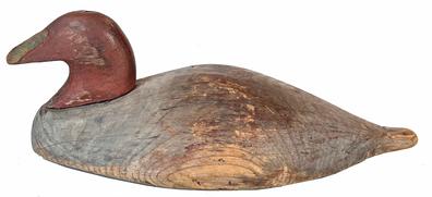 H124 New England hand chopped Decoy ( Eider ) wide body, which is very unusual, leather rigging, pegged head. Approximate Measurements: 17 ¾� long x 9 ½� wide x 6� tall