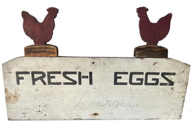 *SOLD* H252 Early 20th century Trade sign for "Fresh Eggs� from Hanover Pennsylvania, in black lettering on a white background with two red painted cut outs of chickens applied to the top.  There is a space below the "Fresh Eggs" for writing the size and price of eggs for the day. From a private Pa collection   Measurements: 26 3/4" wide x 9 3/4" tall x 3/4" thick.  Where the chickens are attached, it measures 16 1/2" tall.