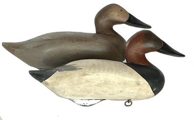 H982 Pair of early Canvasback decoys in original paint by renowned decoy carver R. Madison Mitchell, signed and dated 1953. 