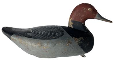 K1630 Redhead Decoy - carved by August Heinefield (1883-1952) from Rock Hall, Maryland. Decoy bears old working paint surface and original weight, staple and ring remain intact on bottom. 