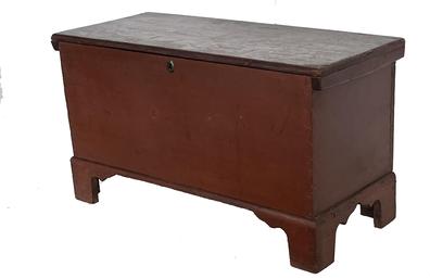 J125 Pennsylvania original red painted blanket chest. Dovetailed case with applied bracket base that is also dovetailed and features tall cut out feet. Interior boasts a lidded till and a clean, natural patina. Circa 1830. Perfect smaller size for a coffee table or for use in a stack! Measurements: 34� wide x 14 ½� deep x 18 ¾� tall 