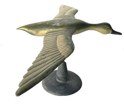 J230 Full sized Flying Duck Decoy with very detailed carved wings and nice dry, original painted surface. Carver unknown. Mounted on a wooden base for display purposes. Measurements: 31 ½� wingspan x 18 ½� beak to tail. The base is 8 ¾� diameter. Overall mounted height is 13 ½� tall.