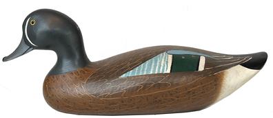 **SOLD** K45 Signed and dated Blue Wing Teal duck decoy carved by Madison Mitchell (1901-1993) of Havre DeGrace, Maryland. Decoy bears its original painted surface featuring scratch painted wings. Engraved on bottom: R. Madison Mitchell 1981. 