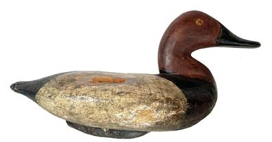 K48 Canvasback Drake Decoy carved by Capt. Ben Dye (1827-1896) of Perryville, MD bearing second coat of working paint. Original iron keel weight intact on bottom. Wear indicative of use. Approximate measurements: 14 ½ long x 6 wide x 7 ½ tall