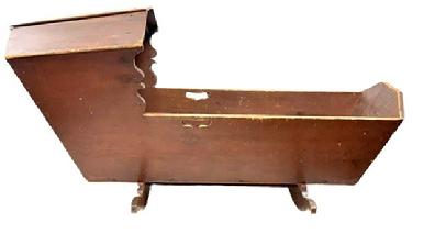 M326 Early 19th century Pennsylvania original red painted Hooded Cradle with canted, dovetailed case resting on shaped rockers. There is a decorative cutout handle on each side and shaped sides below the hood. The interior of the cradle is painted red also. The wood is pine, dovetailed with square head nail construction. Measurements: 50 &frac34;� long x 18 &frac12;� wide (hood) x 15 &frac12;� wide (case) x 24� tall (hood).  