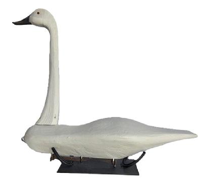 M72 Folk Art Swan Decoy with tack eyes and two railroad spikes as weights on bottom. Hand carved, solid wood. Custom made stand for display purposes is made from iron horseshoes. Carver unknown. Approximate measurements: ~31 long x ~9 wide x ~27 ½ tall. The bottom of the base measures 14 long x 6 wide.