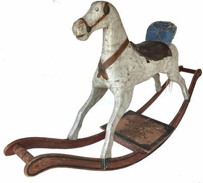 H462 - 19th century American carved Rocking Horse on bow rockers. Original white painted horse resting on bittersweet red painted rockers. Rockers and matching platform are adorned with black, white and mustard decoration. Straw stuffed high-backed leather saddle with horse hair tail.