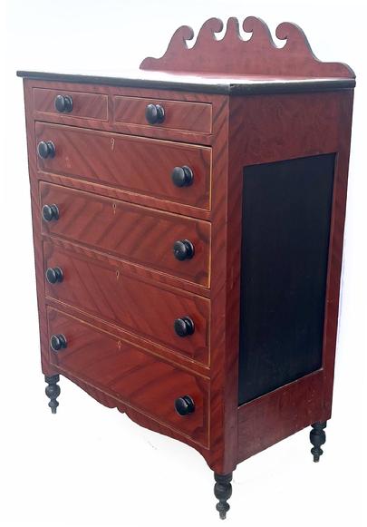 H995 Stunning Soap Hollow (Somerset County, Pennsylvania) Chest of Drawers featuring a beautiful red and black paint decorated surface, decorative cut out backsplash and drop apron, intricate inlaid wooden escutcheons on four drawers, panel ends and applied molding around the top.  Two over four drawer configuration, resting on turned feet. Dovetailed drawers retain crisp beaded edges with original mustard painted detailing around each drawer front. The case and drawer stretchers are fully mortised and wooden pegged. Drawer guides are dovetailed into the posts of case. Nice, thick chamfered panels on the back. Square head nail construction. Hidden locking system evident on underside of top two small drawers. Circa mid-19th century. Measurements: 38� wide x 20 ½� dee x 48 ¾� tall (front) x 55 ¼� tall (back). The raised feet are a full 7� tall.