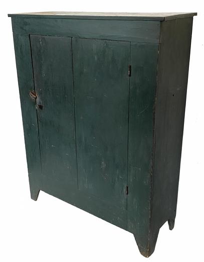 G787 Early 19th century Pennsylvania canning cupboard in old dry red paint. Open top with two batten doors below. Beaded edge around door/openings and nice cut out feet. All square head nail construction. Nice wear and patina indicative of age and use. Measurements: 50" wide x 63 3/4" tall x 18 3/4" deep. The open shelves at the top are 17" deep and opening/ clearance measurement is 6 3/4", 9", 9" respectively from the top to the lowest shelf.