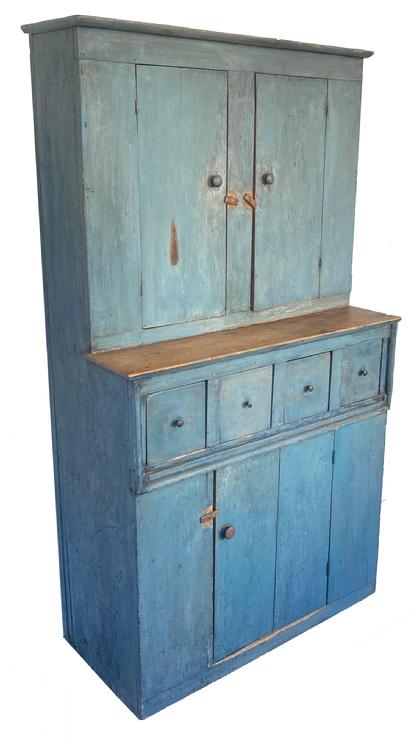 G429Late 19th century period blue painted, very unusual small form, stepback Cupboard from Pennsylvania, wonderful simple form having two plank doors over four dovetailed drawers, over a single plank door at the bottom. Measurements:  69 1/4" high, 39" wide x 17 ½� deep 