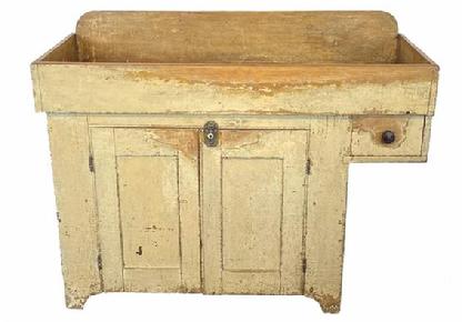  H1072 York County, Pennsylvania drysink with overhanging dovetailed drawer and mortised stretcher bearing light mustard over original yellow painted surface. Beaded edge around doors.  Natural patina interior. Circa 1850s