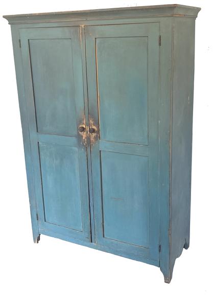  **SOLD** G198 Early 19th century Pennsylvania blue painted two door flat wall cupboard with two panels per door and wonderful drop apron cut out ends. Dovetailed case with applied molding around the top. The interior has six (including the bottom) sturdy shelves for ample storage. Circa 1820.  