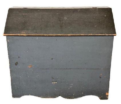 M56 Exceptional 19th century Pennsylvania Bin with divided interior in its original blue painted surface with cut out ends and decorative cut out drop apron. Battens inside the lid have kept the lid from twisting / warping over the years.  The wood is pine with square head nail construction. Circa 1850s. Measurements: 45� wide x 19 &frac14;� deep x 39 &frac12;� x tall (back). 