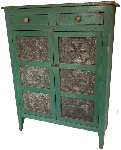 G448  19th century Floyd County Virginia, Pie Safe,with  early  imerial green paint  over the original red, Two doors  that is mortised, with six hand punched tins, the pattern of the tins is a large six peddle flower,  inside of a punched boarder. Two dovetailed drawers, one board ends, natural patina on the inside. circa 184