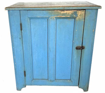 H17 Late 19th century single door storage Cupboard in the original dry robin egg blue paint, with double panel door, very unusual form, the top and the corners and frame of door is chamfered. The interior is old natural patina, with a single shelf. circa 1850 Measurements are 22 1/4" deep x 33 1/2" wide x 36 1/4 tall