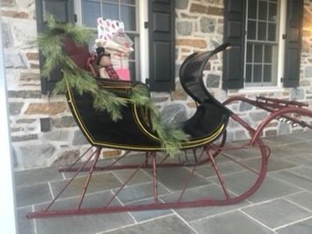 Beautiful Classic Antique Sleigh with the original label (R.M. Bruge Marticville Pennsylvania ) with Shafts w/Bells just in time for Christmas, Black body with maroon upholstery Solid and Sturdy 
