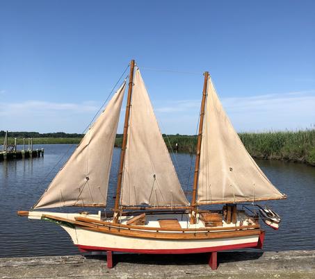 E172  Chesapeake Bay Bugeye, hand made model replice of ( not a kit ) great condition. A bugeye is a two masted sailing vessel used for dredging Oysters.They descended from the log canoe in the time when the need was for a large boat. The Schooners of the day were too large and the canoe was too small. They came into being around 1875.There are only a few of  Theses grat boats.  10 3/4" wide x 44" long x 33 3/4" tall