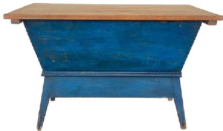G497   Stunning Early 19th Century Pennsylvania Dough Box in beautiful blue paint.  Tightly dovetailed and pegged construction with an apron around the bottom that follows the taper of the legs. Molding surrounds the base of the dough box, just above the apron.  The box is secured to the base with early screws and several original cut nails.  Wonderful two board scrub top is reinforced with a batten screwed underneath on each end � which also act as guides when sliding the top on/off the bottom.  Circa 1820s.  Measurements:  44 ¾� wide x 26� deep x 28 ¼� tall 
