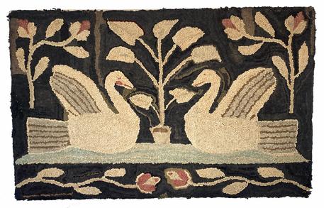 G805 19th century hand hooked rug depicting two large swans facing one another in what appears to be a small pond � with a large plant depicted in the background between the two swans. Each top corner features a vine with rosebuds, and two rosebud vines facing each other creates a border along the bottom. Wool hooked on burlap. Muted colors indicative of age and use over many years. Professionally mounted and ready for hanging. Measurements: 41� wide x 26� tall. 