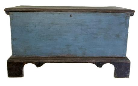 M1104 19th century Eastern Shore, Maryland diminutive Blanket Chest bearing original blue and black painted surface featuring a dovetailed case and a decoratively cut out applied bracket base with tall feet. Six-board yellow pine construction. Great small size. Circa 1850s. Measurements: 32 &frac34;� wide x 15 3/8� deep x 18 &frac12;� tall. 