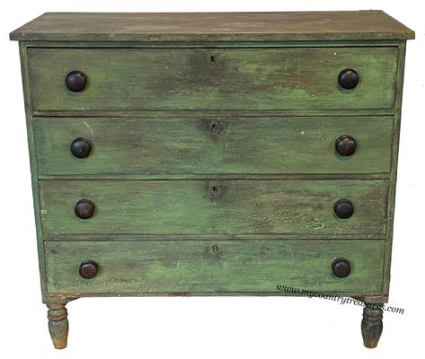 LL1  Early 19th century four drawer pine Chest , found in Buck's County Pennsylvania. This Chest is beautiful in the original dry green paint. The case is dovetailed top and bottom, and the drawers are also dovetailed, it is resting on nicely turned feet. This Chest is one board construction circa 1820   measurements are 18" deep x 42' wide x 38" tall