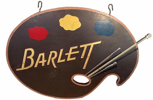 E70  mid-20th century  Wooden Trade Sign for Barlett  art Supplies Circa 1940s: Unusual and well done wooden trade sign for "Barlett " . Collectors of trade signs will appreciate the talented brush work and typographical flair this sign maker exhibited.  Note how the brush was made and applied to the back of the sign A[O1]  metal band was applied to the outside edge to reinforce it on both sides. With it�s original iron hooks for hanging.  Wonderful original surface and great colors make this a highly desirable size and subject matter.   Measures 44" long x 30 1/4" tall x 1" deep