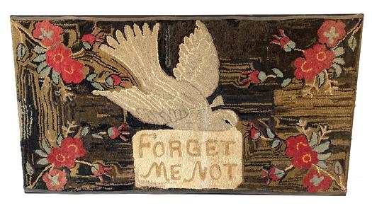 **SOLD** G859 American Folk Art �Forget Me Not� hand-hooked rug on burlap. Rectangular form, depicting a flying dove holding a sign that reads, "FORGET ME NOT" with red flower motifs to each corner, all on a striated field, applied binding to two side edges. Mounted to fabric on a wooden stretcher for hanging. Late 19th century. Rug measurements:  46 1/2" x 25".