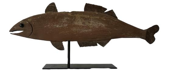 L37 Large Midwestern wooden Fish weathervane in original paint with shaped cut tin fins and tail and carved mouth and gills. The eyes are constructed of two green glass marbles. Mounted on a removable metal stand for display purposes. Found in Indiana. Measurements: 35" long x ~10 ½ tall x 1" thick. Overall height on stand is 15 tall. 