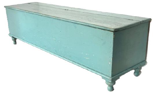 **SOLD** K1828 Early 19th century Lancaster County, Pennsylvania original blue painted lidded wood box resting on turned feet. Applied molding around bottom and rounded edges surround the lid. Dovetailed case. Clean, natural patina divided interior. One board construction. The wood is pine. Circa 1820. Measurements: 72 ¾ wide x 19 deep x 21 ¼ tall.