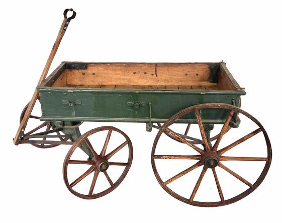H353 Late 19th century Child's wooden Wagon  with removable sides, Notice the spoke wooden wheels. In the original green paint and the wheels are red  . Wagon is all original with a small beak to one of the removale sides. This is a great display pieces