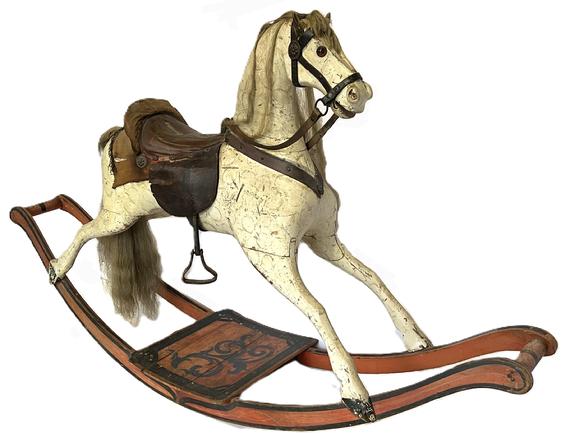 **SOLD** K1853 Large 19th century American carved Rocking Horse on bow rockers. The solid wooden carved horse retains its original white painted surface with mottled paint decoration and rests on original bittersweet red painted rockers. Rockers and matching platform are adorned with black decoration.  Horse boasts glass eyes, great detailed carved nose/mouth and is adorned with a straw stuffed high-backed leather saddle with horsehair mane and tail, realistic metal / leather accoutrements and remnants of a saddle blanket with bullion-fringed edge. Circa 1850s-1860s. Measurements: 62 long x 15 wide x 36 tall. 