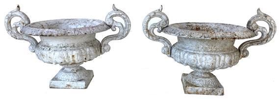 G407 Pair of 19th Century French Cast Iron Planters or Urns small size cast iron garden Urns, circa 1880, the highly detailed and shaped rim leading to fluted body raised on waisted stem, on square plinth base. Image Properties