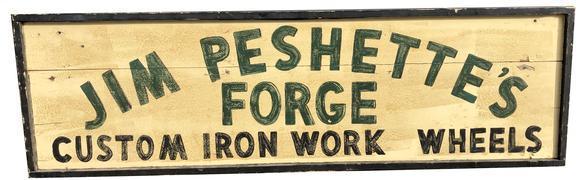 E77 Early 20th century trade sign advertising "Jim Peshette's Forge - Custom Iron Work and Wheels" (early iron wheels for Model T's and wagons) One-sided. Painted on board with green and black letters on an off-white background with black painted applied molding surrounding the edges.  Purchased from a private sign collection in Pennsylvania. Measurements: 18 ¼� high x 61 ¾� wide x 2 ¼� deep  