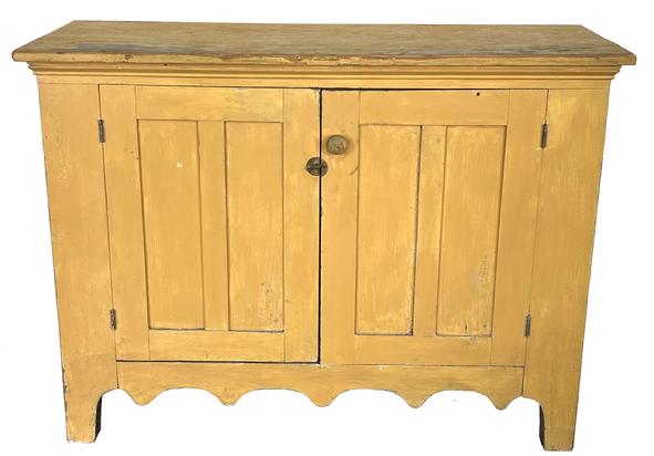 H130 Late-19th century beautiful sideboard / server in old mustard original. Tall cut out feet with graceful drop scallop cutouts along the front. Panel doors and ends. Clean, natural patina interior. Found in Illinois. Measurements: 50 ¾� wide x 21 ¼� deep x 36 ¾� tall