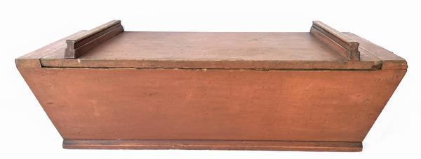 A232 19th century Lancaster County Pennsylvania table top Dough Box in the original red paint. Square head nails with one board construction. One board top with two applied handles. Retains all original surface.  