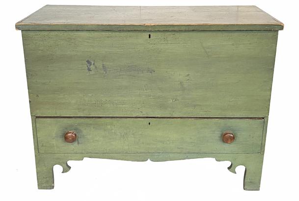G842 New England original painted tall footed pine blanket chest / mule chest featuring six-board, nailed construction with applied edge molding around the hinged lid, with a full dovetailed drawer below, all flanked by solid ends boasting a high, unusual cut-out "whale's tail" profile to base. Retains original hinges and fine green-painted surface. Clean, natural surface interior. Probably Massachusetts. First quarter 19th century. Measurements: 21 ½� deep x 43� wide x 31 ¾� tall