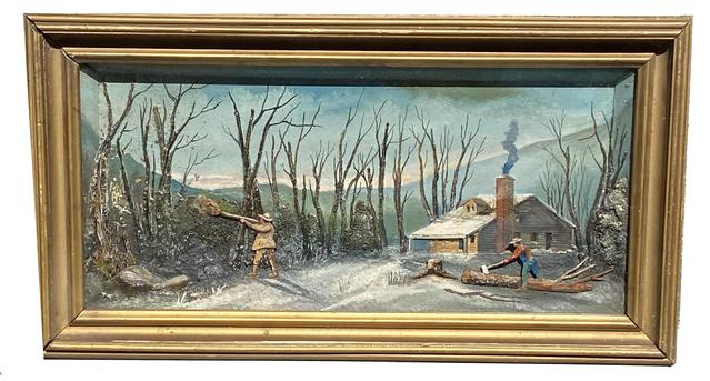 **SOLD** G684 19th century hand made shadow box Diorama depicting a hand carved/painted cabin in the woods with snow on the ground and rooftop, a man swinging an axe to chop on a downed tree, and a man firing a gun into the woods, with a distant mountain range painted in the background. A few of the many three-dimensional details include a �puff� of smoke from the gun, a freshly cut tree stump next to the felled tree, painted hats and clothing on the men, natural twigs and foliage to create the forest, and a carved wood cabin complete with porch. Painted details along the back of the scene accentuate the quaint setting. Framed measurements are 23 1/4� wide x 12 1/2� tall x approximately 2 1/4� deep. The glass viewing area measures 19 1/2� wide x 8 7/8� tall.  