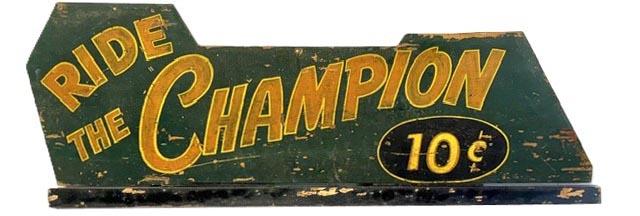 M1186 Early 20th century original painted wooden Folk Art sign reading - "Ride the Champion 10c" - These colorful signs originally accompanied the mechanical coin operated horses made by Bally Company of Chicago, IL, who created a replica of Gene Autreys horse, "Champion" for children to ride and pretend they were a real cowboy! (The initial cost of the ride was 5c, and went up to 10c in late 1940s, and then to 25c in the 1950s). The original painted background is dark green, and features red lettering with yellow outlining. The circle with the price has a black background and the numbers are yellow with red outlining which is reverse of the lettering. The 'odd' shape of the sign is explained by the shape of the base of the ride where it was attached. It is very rare to find one of these wooden signs that accompanied the ride as most that were from the base of the ride itself were made of metal. The sign is a solid piece of pine and the plywood battens on the back are not original but have been there for quite some time as they share the same great patina as the rest of the back. They could have been added for hanging purposes - or to ensure the sign did not twist or warp from changing weather temperatures. This is a great piece of Americana that is sure to bring back fond childhood memories for many! Measurements: 49 1/2" wide x 16" tall x 3/4" thick. 