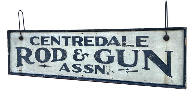 H419 Exceptional 19th century Rhode Island double sided sign advertising "Centredale Rod & Gun Assn." Untouched dry surface with original black painted letters on a white background with a 2 1/4" wide black painted applied molding encasing the entire sign. Extremely well preserved with very slightly weathered surface and minor crackling to paint. Retains early metal wire hangers, as well as several holes for optional ways of hanging / displaying. "Centredale" (also spelled "Centerdale") is a village within the town of North Providence, Rhode Island. Documentation indicates the Centredale Rod & Gun Assn. was host to many trap shoots in the Summer of 1898 that included famous  shooters of the era from as far away as the state of California. This would be a fantastic addition to any Sportsman's collection! Measurements: 61 1/4" wide x 2 1/4" thick x 16" tall