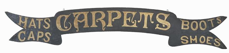 *SOLD* J296 Superb mid-19th century banner / ribbon, shaped Trade Sign advertising �Carpets� in the center � with �Hats� and �Caps� on the left, and �Boots� and �Shoes� on the right. Fantastic original painted surface consisting of gold gild hand painted letters on a black painted background. Circa 1850-1860s. Measurements: 70 ½� wide x 8� tall (11 ¼� at tallest points) x ½� thick.