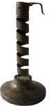 V444 18th century wrought iron spiral and wooden based primitive candleholder, called   courting candlestick. note burn spot on base  Measures 7 1/2" base 4" diameter