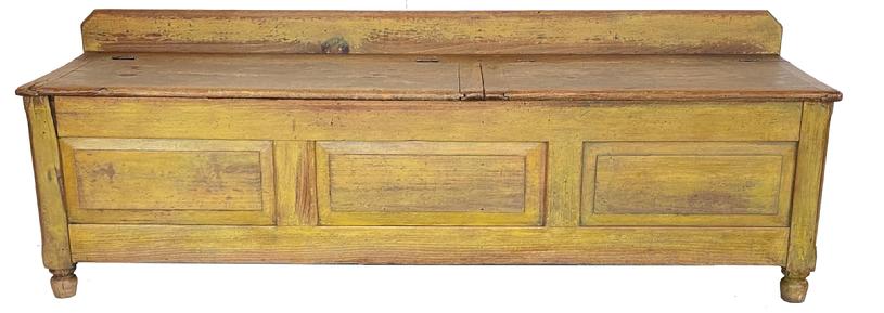 G745 18th century New England wood box with three raised panels and beautiful yellow paint. Post-and-panel construction with each of the four corner posts ending in nicely turned feet. The split top boasts bread board ends and the internal center divider is dovetailed into the case. Measurements: 67 ½� wide x 19� deep x 23� tall (back) x 18 ¾� tall (front).