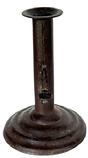 M116F Rare, tapered / stacked base Hog Scraper candlestick with illegible maker�s stamp on the push-up tab. Sheet iron construction with nice weight and unusual base, with no evidence of ever having a finger curl. Wonderful original surface. Measurements: 4 1/8� bottom diameter x 6� tall.   