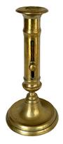 M142 19th century solid Brass Push Up Candlestick. Nice, heavy weight and the push-up feature is fully functional. Measurements: 4 1/8 bottom diameter x 8 tall.